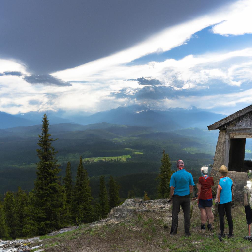 A group of hikers takes a break to admire the stunning panoramic view from Sheep Mountain Fire Lookout.